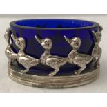 A Links of London silver pin dish holder with duck decoration and blue glass liner.