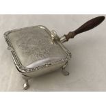 A Harrods silver plated four footed "Silent Butler" with wooden handle and engraved detail to lid.