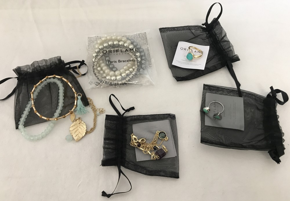 A collection of Oriflame costume jewellery with original packaging.