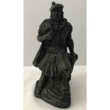 A signed John Letts sculpture of a highlander.