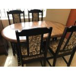 A dark oak solid wood New Plan Furniture Ltd draw leaf table and 4 chairs.