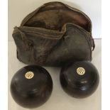 A pair of vintage lawn bowls.