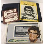 A boxed vintage Stylophone with cased sheet music and instruction manual.