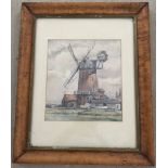 A framed and glazed water colour of a windmill.