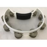 A modern half moon shaped tambourine by Rhythm Tech.