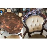 A ornate high polished dining room table with 4 chairs and 2 carvers.