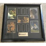 A framed and glazed Shrek 2 Special Edition original film cell and photo still set.