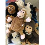 A box of assorted soft toy monkeys.