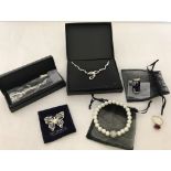 A collection of silver and gold tone costume jewellery by Oriflame in original boxes and packaging.