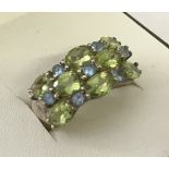 A 925 silver peridot and blue topaz dress ring.