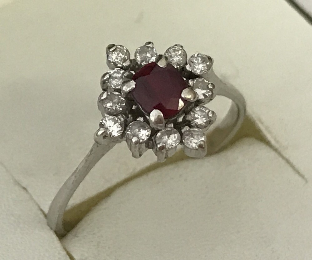 A 14ct white gold ruby and diamond dress ring.