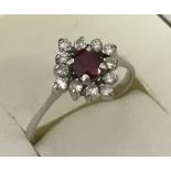 A 14ct white gold ruby and diamond dress ring.