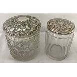 Embossed silver top jar (London 1912) with a silver plated dressing table jar.