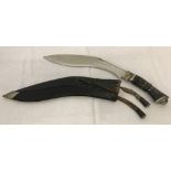 A vintage Kukri knife in sheath with 2 small knives.