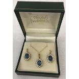 9ct gold blue topaz & CZ pendant necklace with matching drop earrings.