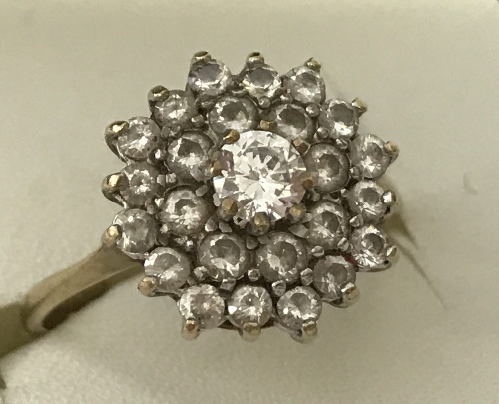 9ct gold CZ cluster ring with centre stone elevated.