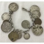 A sterling silver chain bracelet attached with a collection of Russian, Canadian and Indian coins.