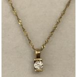 A 9ct gold pendant set with solitaire .15ct round cut diamond.