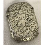 A silver vesta case with floral engraved detail. Hallmarked Birmingham 1897.