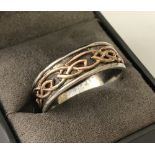 A men's Clogau silver wedding band with original box.