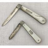 2 silver bladed fruit knives with mother of pearl handles.