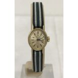 Ladies Tissot mechanical watch with 9ct gold case. In working order.