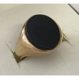 9ct gold onyx set signet ring.