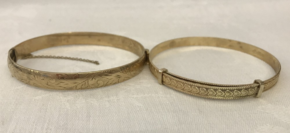 2 rolled gold vintage bracelets.