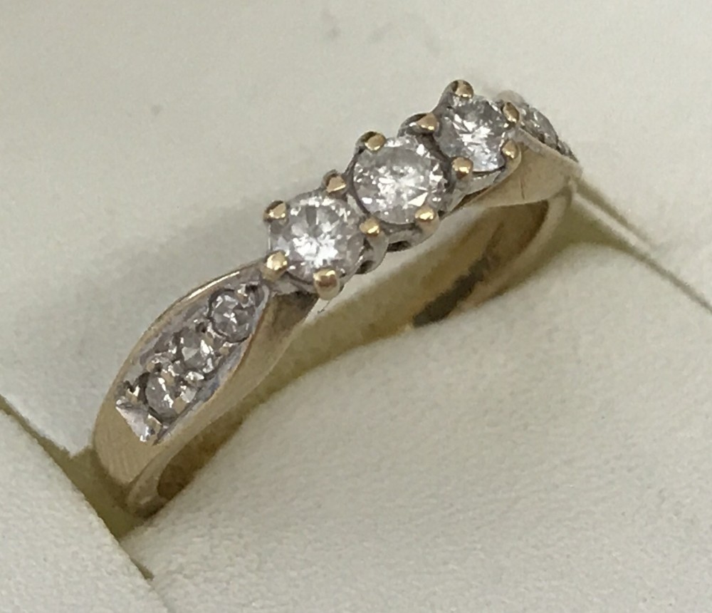 A 9ct gold and diamond trilogy ring.