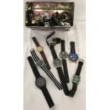 A tin of assorted men's, women's and children's wristwatches in varying conditions.