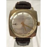 A men's O.M.G.S Time wristwatch with square shaped gold tone case.