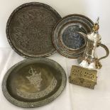 A collection of metal ware items to include Arabic trays and a decorative silver plate coffee pot.