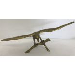 A large brass eagle desk ornament.