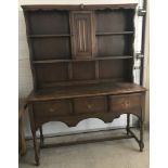 A vintage dark wood 2 sectional sideboard.