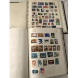 2 vintage albums containing world stamps.