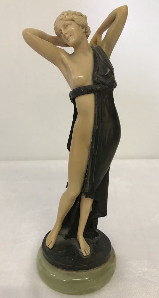 A c1960's bronze & resin nude figure on an onyx plinth.