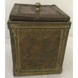 An Arts & Crafts square shaped metal covered wooden tea caddy.