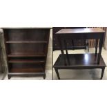 A vintage dark wood Stag bookcase together with a matching coffee table and one other.