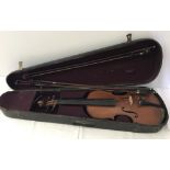 A vintage child's violin with 3 bows in Wooden case.