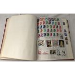 A red Kingston stamp album full of world stamps.