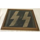 WW2 pattern German Waffen SS flag fragment in 30 x 35cm frame.