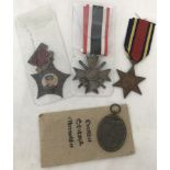 4 assorted medals. To include a Burma Star, Chinese medal and German WWII pattern War Merit.