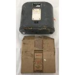 An F24 Aerial Reconnaissance camera film magazine together with a boxed registers glass.
