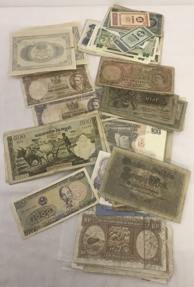 A quantity of 60+ British and foreign bank notes.
