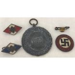 A German WWII pattern medal together with 4 German Party badges (1 a/f).