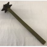 A WWI pattern British Trench Fighting mace on an entrenching tool handle.