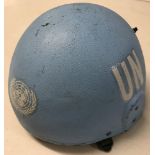 A vintage blue UN helmet.