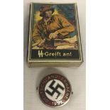 A WWII pattern German Party badge together with a box of SS matches.