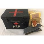 A vintage A.R.P black tin first aid box.