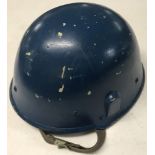 A vintage blue Yugoslavian helmet.